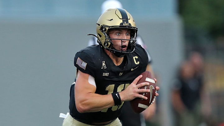 Aug 30, 2024; West Point, New York, USA; Army Black Knights quarterback Bryson Daily (13) carries the ball against the Lehigh Mountain Hawks during the first half at Michie Stadium. Mandatory Credit: Danny Wild-Imagn Images