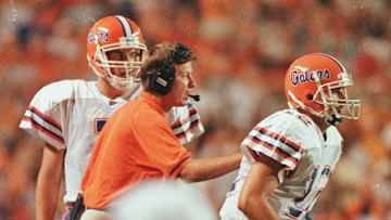 Sept. 19, 1998; Knoxville, TN, USA; Gator head coach Steve Spurrier sends Doug Johnson, 12,  as quarterback while Jesse Palmer,7,  stays back to receive instructions  at the Florida v. Tennessee game at Neyland Stadium. Spurrier once again utilized the quarterback shuffle that work well at the end of the 1997 season; Mandatory credit: Tim Davis-USA TODAY NETWORK via Imagn Images 