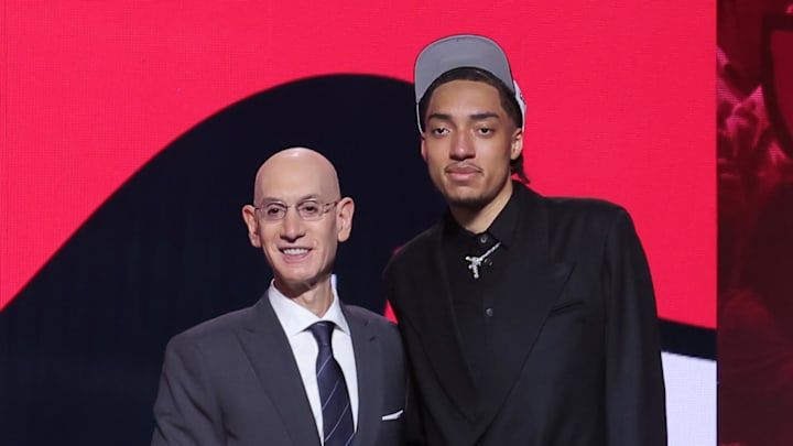 Jun 25, 2025; Brooklyn, NY, USA; Noa Essengue stands with NBA commissioner Adam Silver after being selected as the 12th pick by the Chicago Bulls in the first round of the 2025 NBA Draft at Barclays Center. Mandatory Credit: Brad Penner-Imagn Images