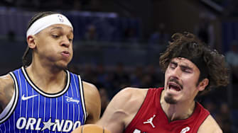 Miami Heat forward Jaime Jaquez Jr. is guarded by Orlando Magic forward Paolo Banchero.