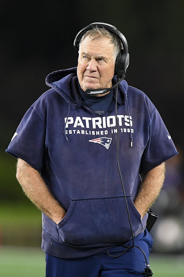 New England Patriots head coach Bill Belichick walks the sidelines during the second half against the Tampa Bay Buccaneers. New England Patriots head coach Bill Belichick walks the sidelines during the second half against the Tampa Bay Buccaneers.