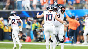 Sep 21, 2025; Inglewood, California, USA; Denver Broncos offensive tackle Garett Bolles (72) and Denver Broncos quarterback Bo Nix (10) react afte4r a play during the first half against the Los Angeles Chargers at SoFi Stadium. Mandatory Credit: William Navarro-Imagn Images