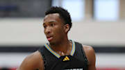 Huntington Prep guard Darryn Peterson takes the ball up the court during the first half at Canton Memorial Field House, Saturday, Feb. 17, 2024.