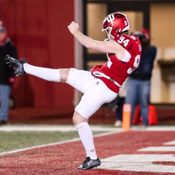 James Evans punts against Minnesota.