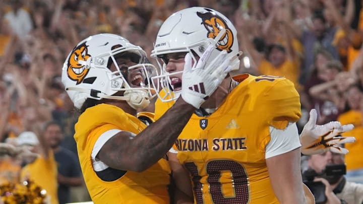 ASU Sun Devils quarterback Sam Leavitt (10) celebrates his touchdown run with teammate Jordyn Tyson (0) Jordyn Tyson against the Mississippi State Bulldogs at Mountain America Stadium in Tempe on Sept. 7, 2024.