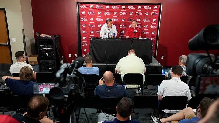 Wisconsin Badgers head coach Luke Fickell (left) answers questions with Wisconsin Director of Football Brand Communications Brian Lucas during Wisconsin Badgers football media day at Camp Randall Stadium in Madison August 1.