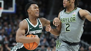 Michigan State guard Tyson Walker drives against Baylor guard Jayden Nunn during the second half of