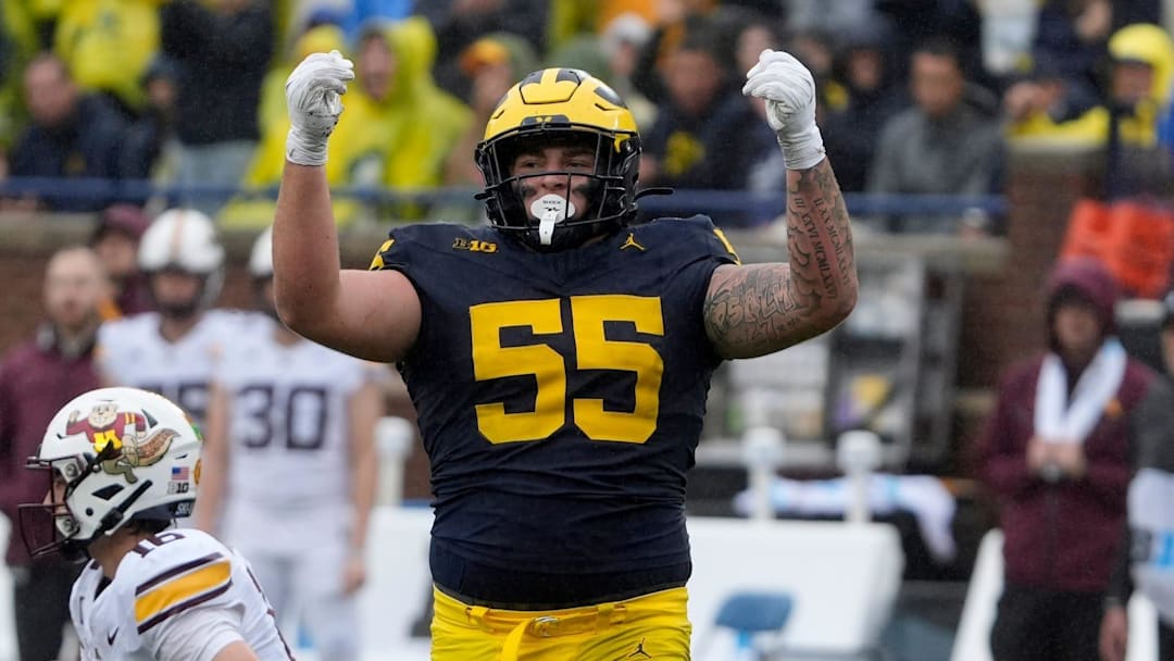 CAROLINA PANTHERS: Michigan defensive lineman Mason Graham celebrates after sacking Minnesota quarterback Max Brosmer, in the background, during first-half action between Michigan and Minnesota at Michigan Stadium in Ann Arbor on Saturday, Sept. 28, 2024.