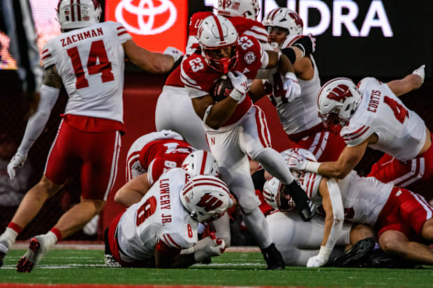 Dante Dowdell escapes a Wisconsin tackle to gain more yardage. 