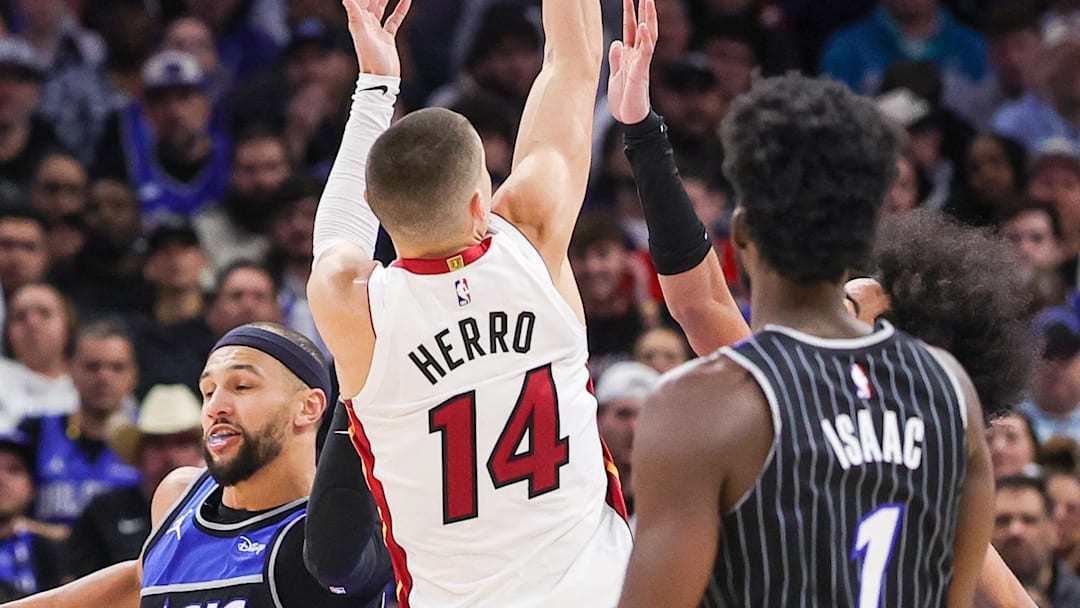 Dec 9, 2025; Orlando, Florida, USA; Miami Heat guard Tyler Herro (14) shoots during the second half against the Orlando Magic at Kia Center. Mandatory Credit: Mike Watters-Imagn Images