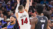 Dec 9, 2025; Orlando, Florida, USA; Miami Heat guard Tyler Herro (14) shoots during the second half against the Orlando Magic at Kia Center. Mandatory Credit: Mike Watters-Imagn Images