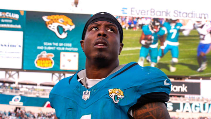Jacksonville Jaguars running back Travis Etienne Jr. (1) walks off the field