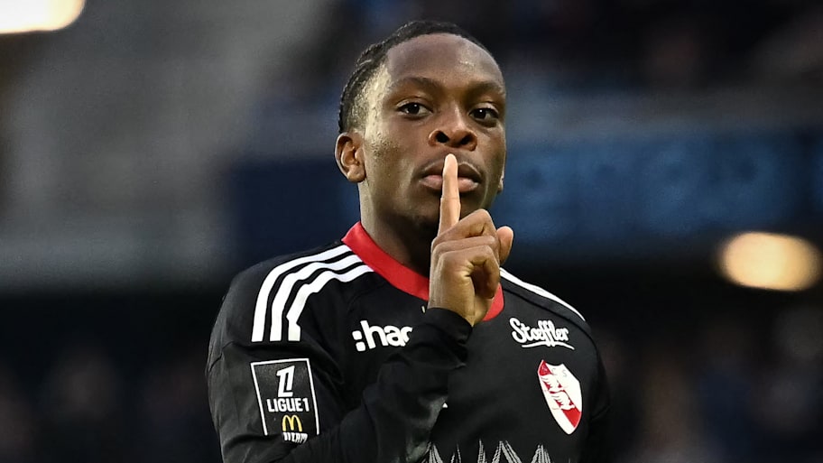 Martial Godo shushing.