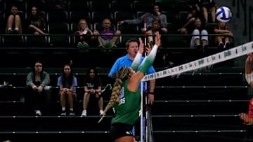 Middle blocker Sabrina Skyers blocks a kill attempt in the Pelican Invitational