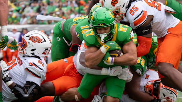 dan lanning oregon ducks northwestern wildcats oklahoma state cowboys dante moore quarterback running backs wide receiver