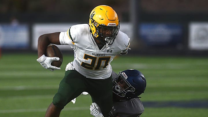 Bishop Manogue’s Pele Masina tries to break a tackle while taking on Damonte Ranch in Reno on Aug. 16, 2024.