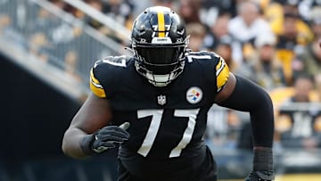 Dec 3, 2023; Pittsburgh, Pennsylvania, USA;  Pittsburgh Steelers offensive tackle Broderick Jones (77) at the line of scrimmage against the Arizona Cardinals during the first quarter at Acrisure Stadium. Mandatory Credit: Charles LeClaire-Imagn Images