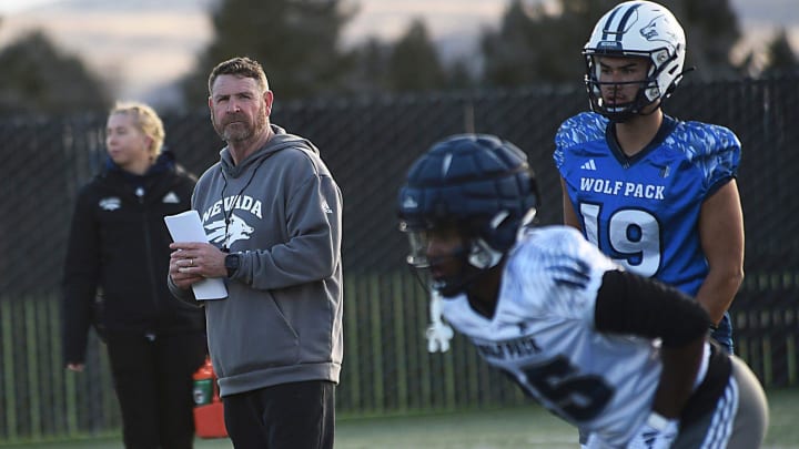 New Nevada head football coach Jeff Choate, middle left, presides over the first day of spring practice in Reno on March 12, 2024.