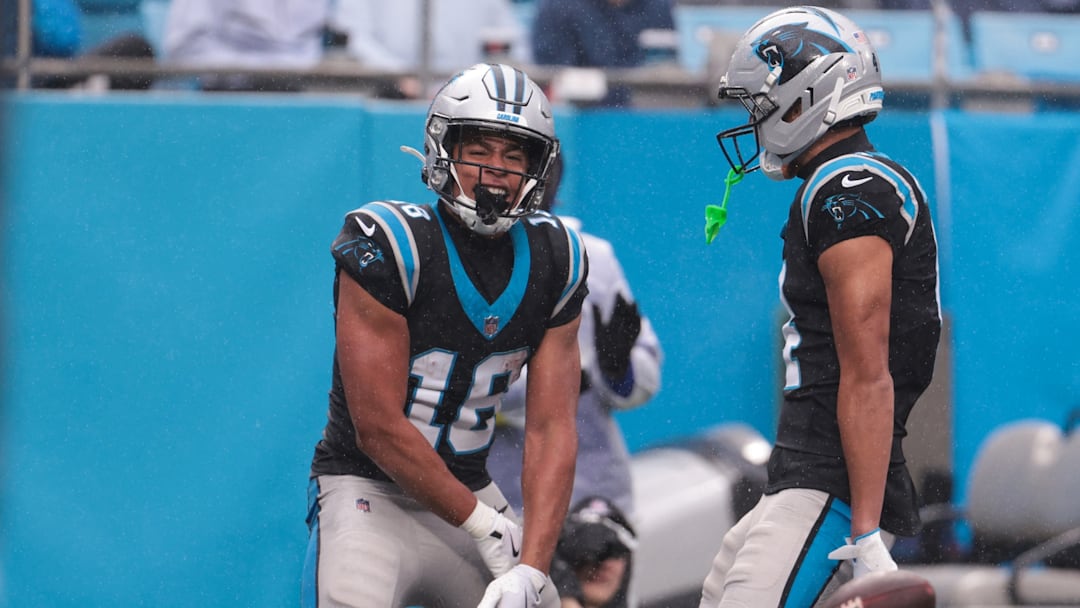 Nov 30, 2025; Charlotte, North Carolina, USA; Carolina Panthers wide receiver Jalen Coker (18) celebrates after scoring a touchdown during the third quarter at Bank of America Stadium. 