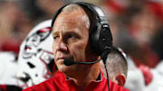 Nov 1, 2025; Raleigh, North Carolina, USA;  NC State Wolfpack head coach Dave Doeren during the first quarter at Carter-Finley Stadium. Mandatory Credit: Zachary Taft-Imagn Images