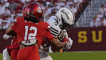 Iowa State Cyclones' wide receiver Brett Eskildsen (9) makes a catch around Arizona Wildcats defensive back Genesis Smith (12) during the second quarter in the Big-12 conference showdown on Sept. 27, 2025, at Jack Trice Stadium in Ames, Iowa.