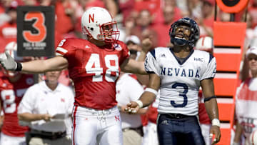 Nebraska Cornhuskers fullback Sam Hill pleads to the official as Nevada Wolf Pack cornerback Paul Pratt looks skyward as the official called another pass interference on the Wolf Pack in the first quarter at Memorial Stadium. Nebraska won 52-10.