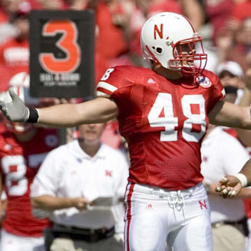 Nebraska Cornhuskers fullback Sam Hill pleads to the official as Nevada Wolf Pack cornerback Paul Pratt looks skyward as the official called another pass interference on the Wolf Pack in the first quarter at Memorial Stadium. Nebraska won 52-10.