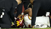 Jayden Daniels suffered a dislocated elbow in the Commanders Week 9 loss. 