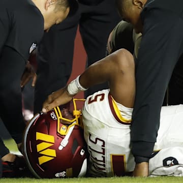 Jayden Daniels suffered a dislocated elbow in the Commanders Week 9 loss. 