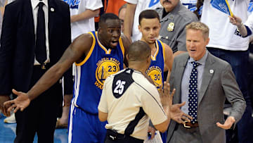 May 22, 2016; Oklahoma City, OK, USA; Golden State Warriors forward Draymond Green (23) and guard Stephen Curry (middle) and head coach Steve Kerr (right) argue with official Tony Brothers (25) during the first half against the Oklahoma City Thunder in game three of the Western conference finals of the NBA Playoffs at Chesapeake Energy Arena. Mandatory Credit: Mark D. Smith-Imagn Images