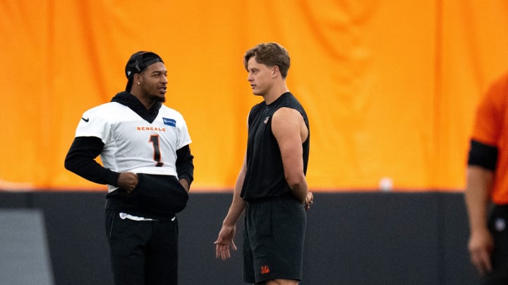 Ja'Marr Chase and Joe Burrow talk during mandatory minicamp