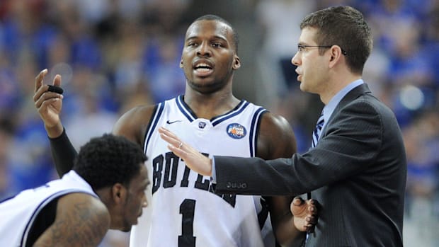 Shelvin Mack talks with Butler coach Brad Stevens.