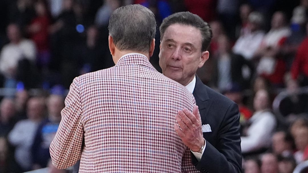 St. John's Red Storm coach Rick Pitino and Arkansas Razorbacks coach John Calipari shake hands as the Razorbacks won a second round men’s NCAA Tournament game at Amica Mutual Pavilion.