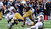 Aug 30, 2014; South Bend, IN, USA; Notre Dame Fighting Irish quarterback Malik Zaire (8) runs the ball against the Rice Owls in the fourth quarter at Notre Dame Stadium. Notre Dame won 48-17.