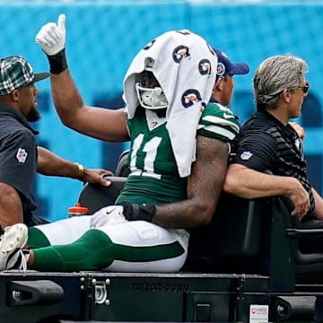 New York Jets linebacker Jermaine Johnson (11) exits the field after an injury during the third quarter against the Tennessee Titans at Nissan Stadium in Nashville, Tenn., Sunday, Sept. 15, 2024.