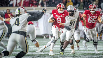 Indiana's Kurtis Rourke (9) runs during the Indiana versus Purdue football game at Memorial Stadium on Saturday, Nov. 30, 2024.