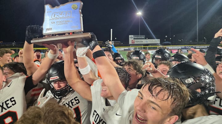 The Silverton football team celebrates after its 24-14 victory over Summit to win the Class 5A state championship Friday night.