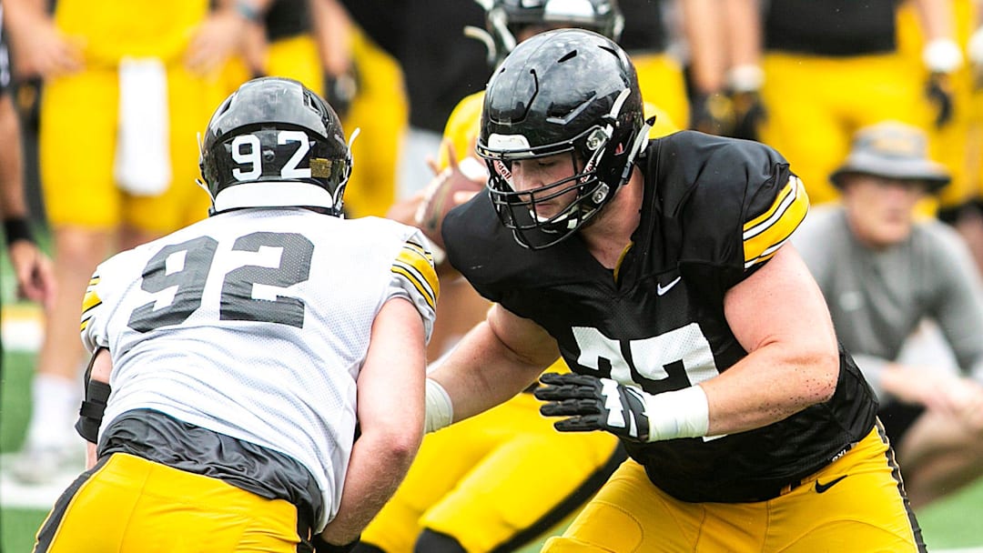 Iowa offensive lineman Connor Colby (77) blocks against defensive lineman John Waggoner (92) during the Kids Day at Kinnick NCAA football practice, Saturday, Aug. 13, 2022, at Kinnick Stadium in Iowa City, Iowa.

220813 Ia Kids Day Fb 082 Jpg