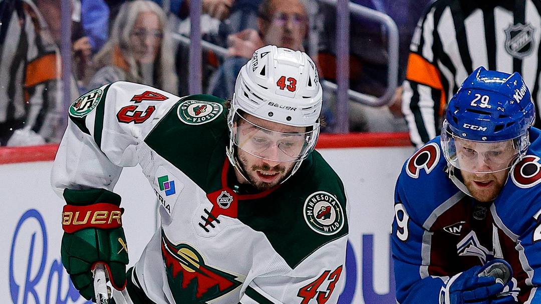 May 13, 2026; Denver, Colorado, USA; Minnesota Wild defenseman Quinn Hughes (43) controls the puck under pressure from Colorado Avalanche center Nathan MacKinnon (29) in the third period in game five of the second round of the 2026 Stanely Cup Playoffs at Ball Arena. Mandatory Credit: Isaiah J. Downing-Imagn Images May 13, 2026; Denver, Colorado, USA; Minnesota Wild defenseman Quinn Hughes (43) controls the puck under pressure from Colorado Avalanche center Nathan MacKinnon (29) in the third period in game five of the second round of the 2026 Stanely Cup Playoffs at Ball Arena. Mandatory Credit: Isaiah J. Downing-Imagn Images