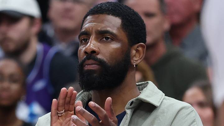 Jan 8, 2026; Salt Lake City, Utah, USA; Dallas Mavericks guard Kyrie Irving (11) watches play against the Utah Jazz in street clothes during the first half of the game at Delta Center. Mandatory Credit: Rob Gray-Imagn Images