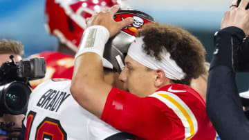 Feb 7, 2021; Tampa, FL, USA;  Tampa Bay Buccaneers quarterback Tom Brady (left) greets Kansas City Chiefs quarterback Patrick Mahomes following Super Bowl LV at Raymond James Stadium.  Mandatory Credit: Mark J. Rebilas-USA TODAY Sports