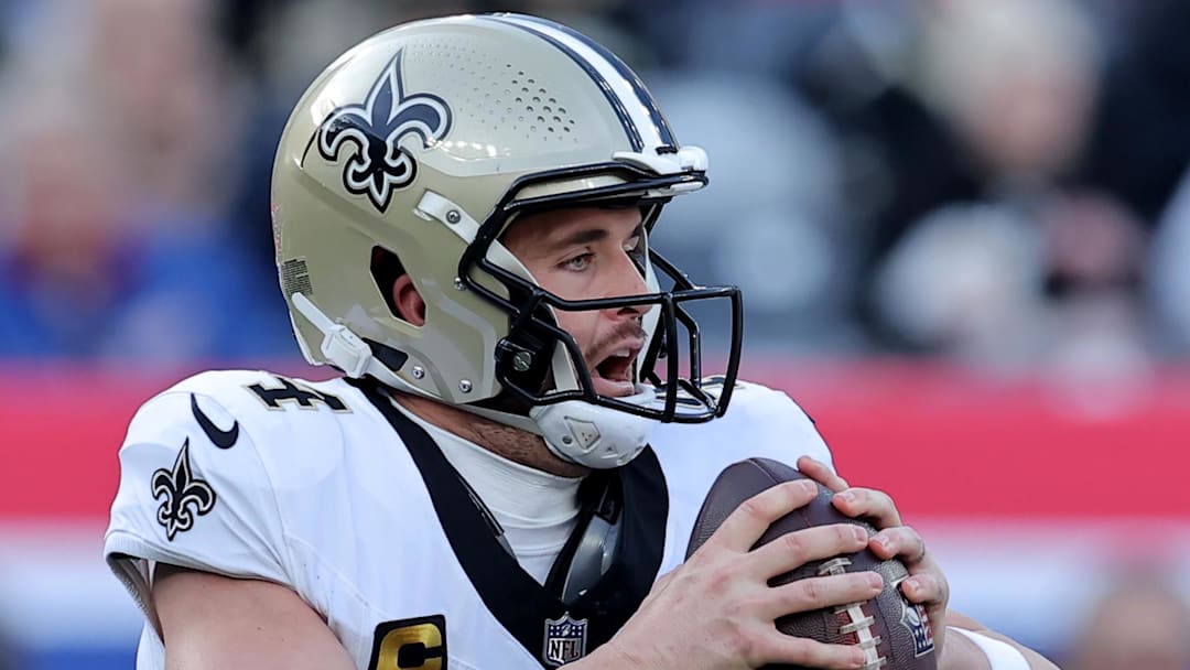 Dec 8, 2024; East Rutherford, New Jersey, USA; New Orleans Saints quarterback Derek Carr (4) drops back to pass against the New York Giants during the first quarter at MetLife Stadium. Mandatory Credit: Brad Penner-Imagn Images