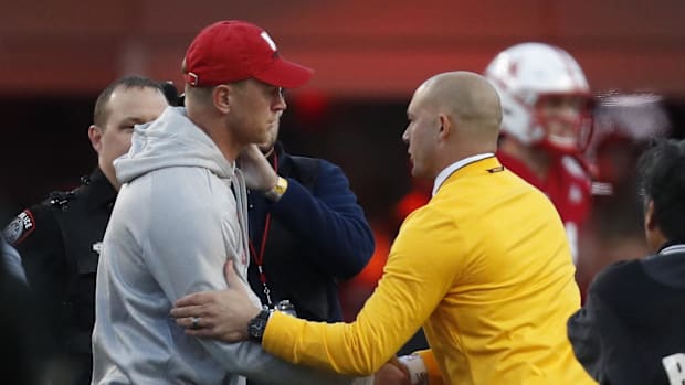 Nebraska Cornhuskers head coach Scott Frost (left) and Minnesota Golden Gophers head coach P.J. Fleck (right) shake hands