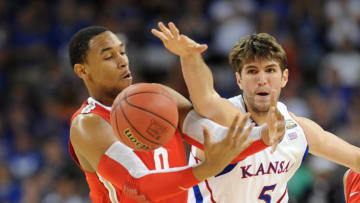 Mar 31, 2012; New Orleans, LA, USA; Kansas Jayhawks center Jeff Withey (5) knocks the ball out of the hands of Ohio State Buckeyes forward Jared Sullinger (0) during the second half in the semifinals of the 2012 NCAA men's basketball Final Four at the Mercedes-Benz Superdome. Mandatory Credit: Bob Donnan-USA TODAY Sports