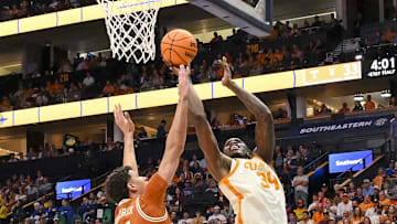 Mar 14, 2025; Nashville, TN, USA;  Tennessee Volunteers forward Felix Okpara (34) shoots over  Texas Longhorns forward Kadin Shedrick (5) during the second half at Bridgestone Arena. Mandatory Credit: Steve Roberts-Imagn Images