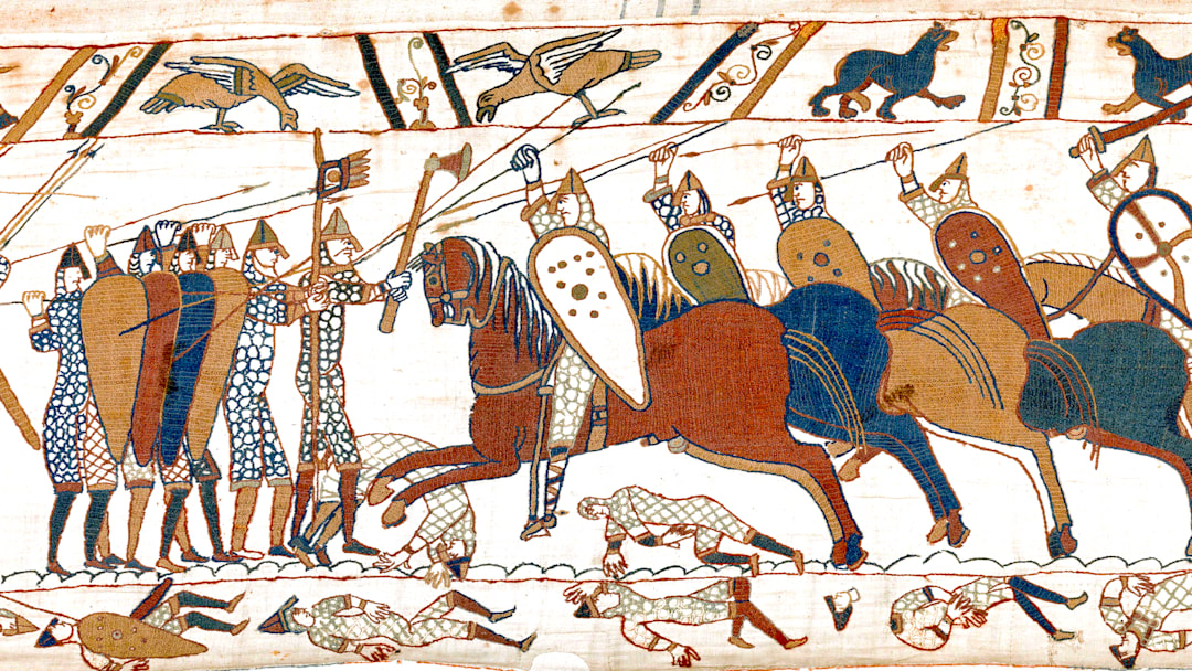 Detail of Scene 52 of the Bayeux Tapestry showing a group of horsemen fighting with spears and swords, armored with mail-shirts and helmets, and carrying shields.