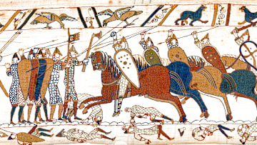 Detail of Scene 52 of the Bayeux Tapestry showing a group of horsemen fighting with spears and swords, armored with mail-shirts and helmets, and carrying shields.