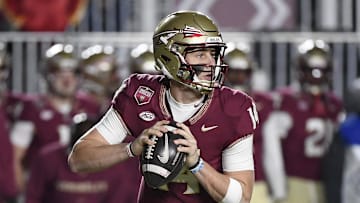Nov 30, 2024; Tallahassee, Florida, USA; Florida State Seminoles quarterback Luke Kromenhoek (14) looks to pass during the first half against the Florida Gators at Doak S. Campbell Stadium. Mandatory Credit: Melina Myers-Imagn Images