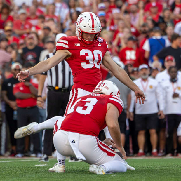 Nebraska kicker Tristan Alvano kicks an extra point in the first quarter against Colorado.