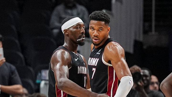 Oct 28, 2026; Atlanta, Georgia, USA; Miami Heat center Bam Adebayo (13) and forward Giannis Antetokounmpo (7) react at the end of the game against the Atlanta Hawks at State Farm Arena. Mandatory Credit: Dale Zanine-Imagn Images